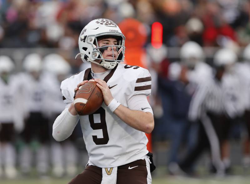 Mt. Carmel's Jack Elliott (9) gets set to pass during the class 7A semi-final playoff game between Mt. Carmel and St. Rita high schools on Saturday, Nov. 23, 2024 in Chicago.