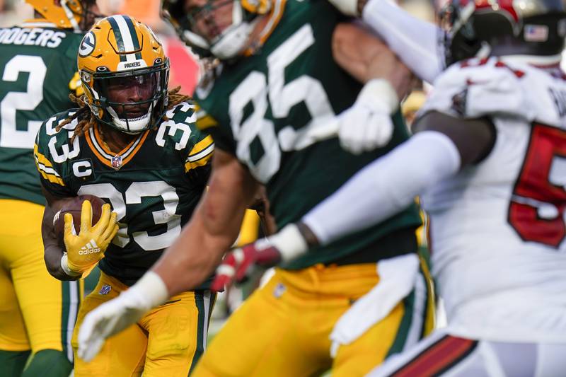 Green Bay Packers' Aaron Jones runs during the first half of an NFL football game against the Tampa Bay Buccaneers Sunday, Sept. 25, 2022, in Tampa, Fla. (AP Photo/Chris O'Meara)