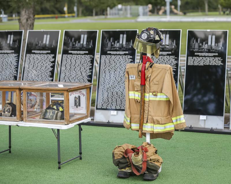A display honoring the falling fire fighters of 9/11 at the Vietnam Traveling Memorial Wall Thursday, Aug 21, 2025  in Romeoville.