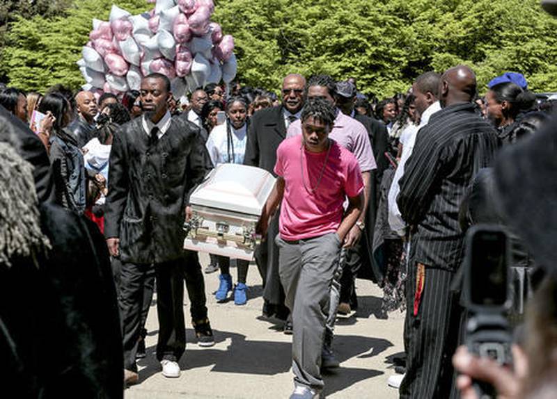 Pallbearers carry the coffin of Sema'j Crosby on May 5 at Elmhurst Cemetery in Joliet. Will County Coroner's Office revealed Friday that she died from suffocation at the hands of another.