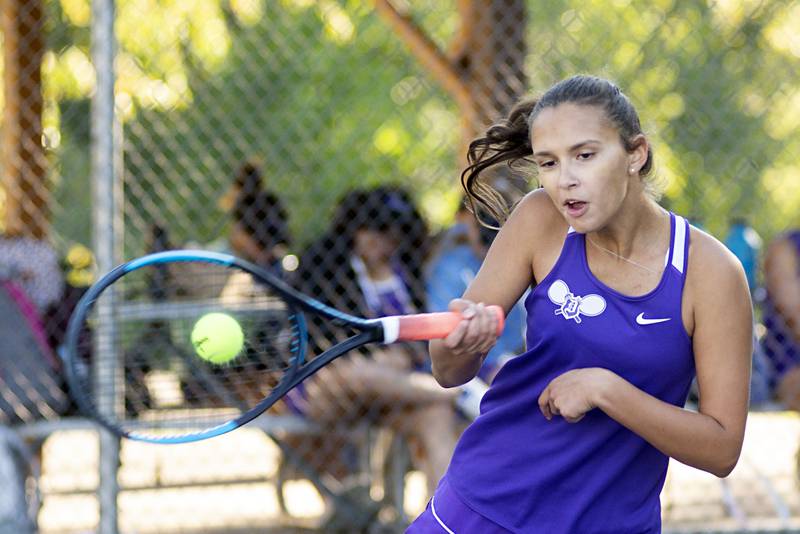 Dixon’s Addison Arjes returns a shot against Sterling’s Ellie Aitken Thursday, Sept. 29, 2022.