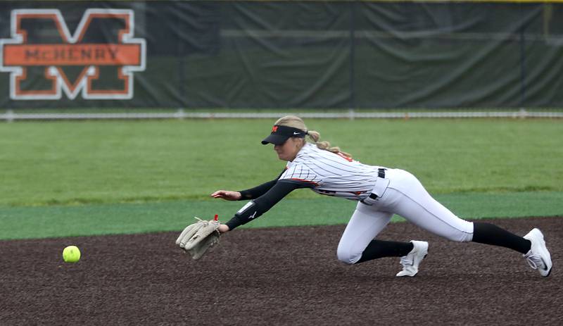 McHenry's Hailey Townsend tries to dive for the ball during a Fox Valley Conference softball game against Cary-Grove on Thursday, April 30, 2026, at McHenry High School.