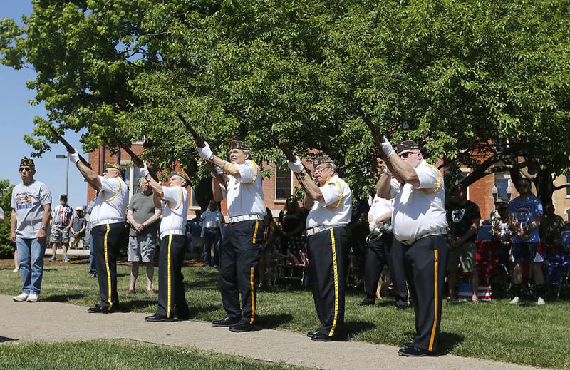 Members of the Woodstock VFW Post 5040  Honor Guard fire a salute during the Woodstock VFW Post 5040 City Square Memorial Day Ceremony and Parade on Monday, May 29, 2023, in Woodstock.