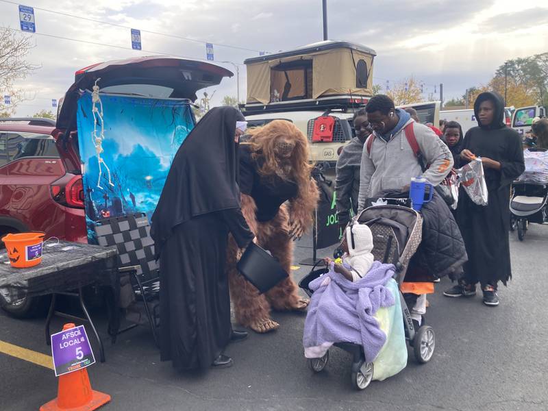 Families trick or treat at the Joliet Police's trunk-or-treat event. 
Saturday, Oct. 25, 2025.