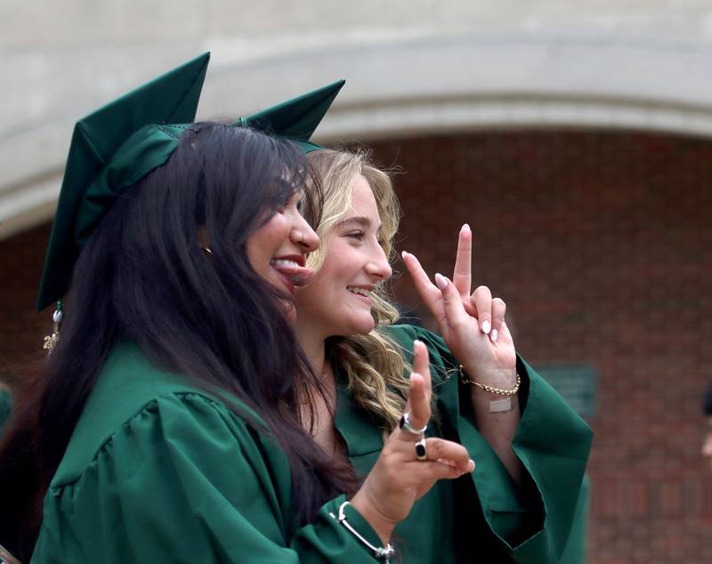 Alyssa Kachappilly, left, and Anna Copher pose for picture before graduation at York High School in Elmhurst on Sunday, May 18, 2025.
