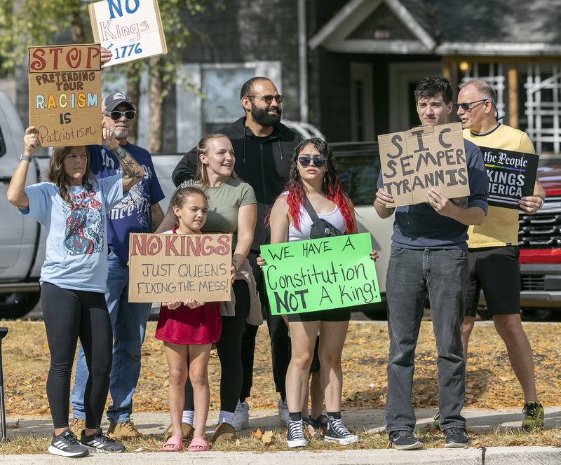 Protesters line Fourth Street in Sterling on Saturday, Oct. 18, 2025, during the “No Kings” rally.