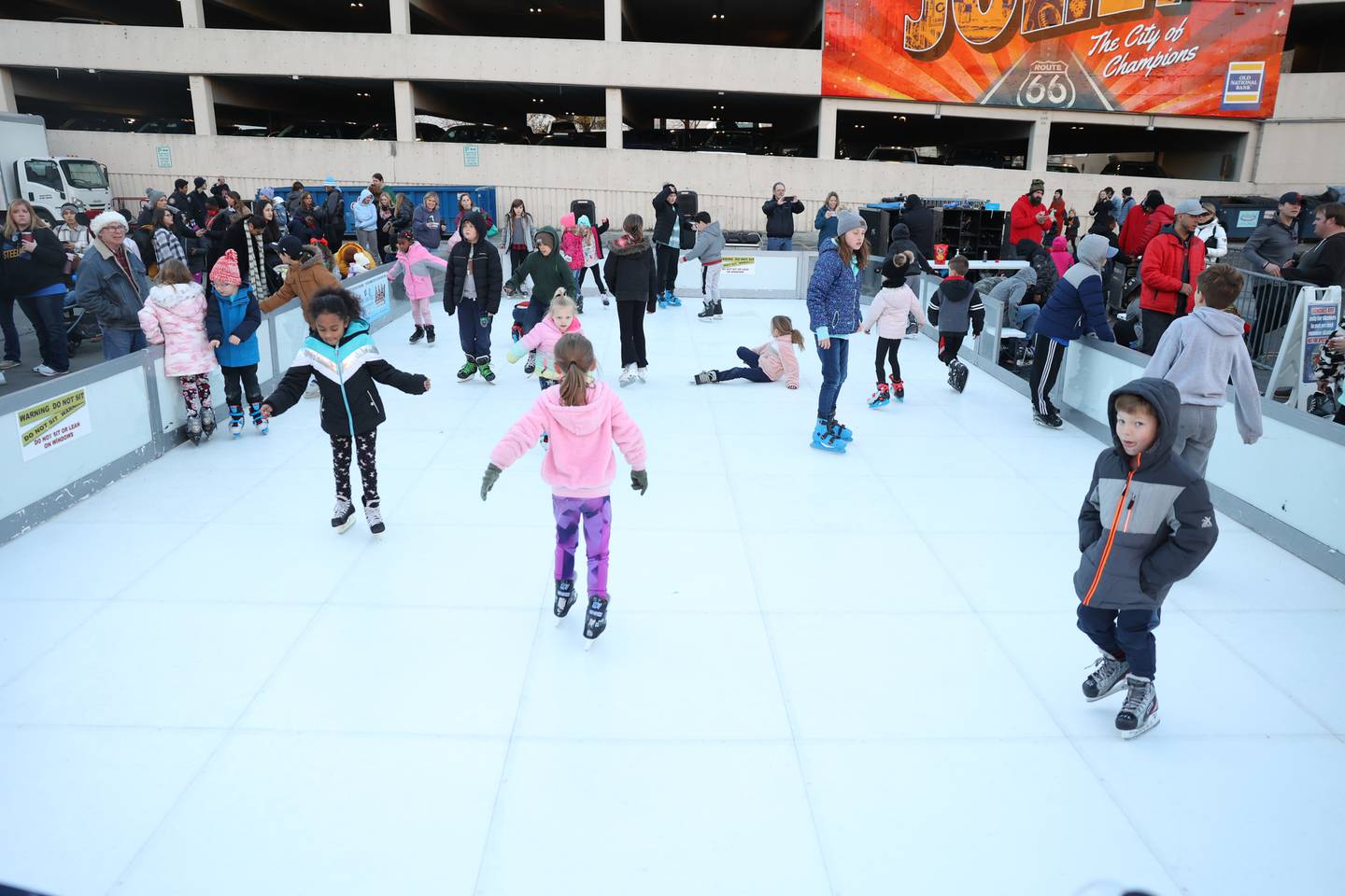 A small iceless rink was one of the new attractions at the Light Up the Holidays Festival and Parade in downtown Joliet.