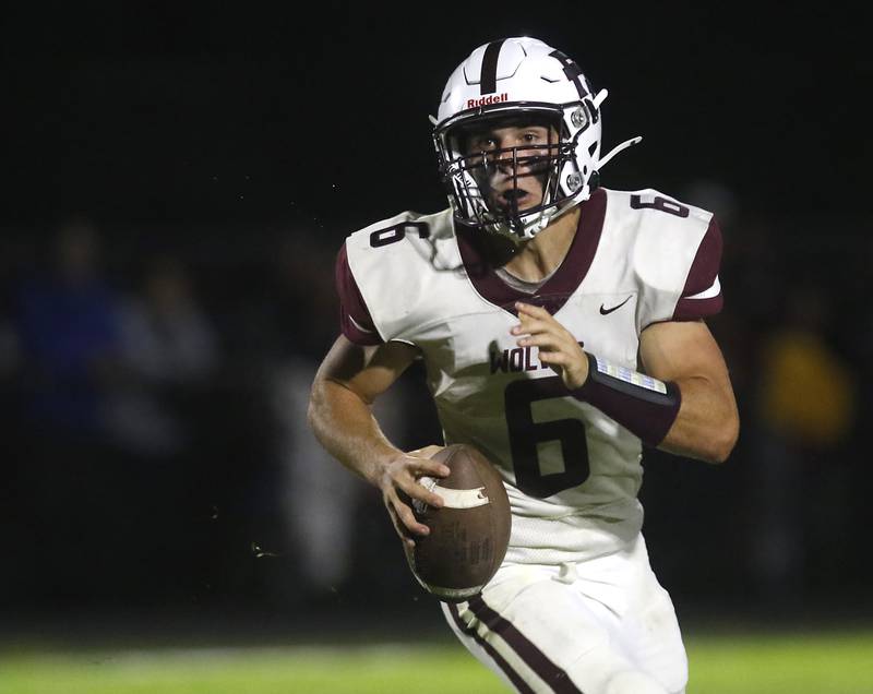 Prairie Ridge's Luke Vanderwiel scrambles for his third touchdown during a Fox Valley Conference football game against Cary-Grove on Friday, Aug. 29, 2025, at Cary-Grove High School in Cary.