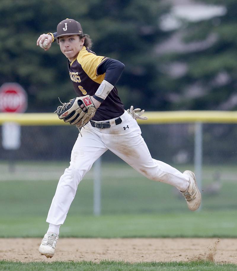 Jacobs's Caden Guenther makes a throw to first base to get the runner during a Fox Valley Conference baseball game Thursday, May 5, 2022, between Jacobs and Cary-Grove at Jacobs High School.