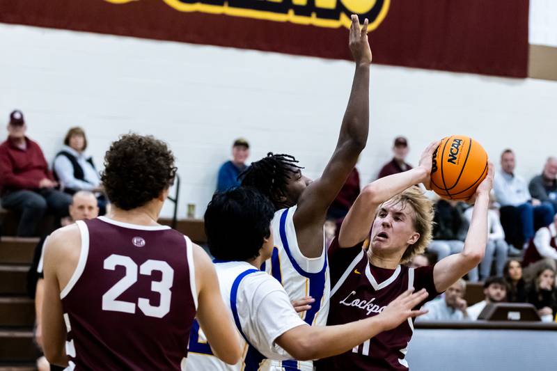 Lockport's Nedas Venckus drives towards the basket during a WJOL Thanksgiving Classic Boys Basketball game against Joliet Central at the University of St. Francis’s Pat Sullivan Center in Joliet on Nov. 24, 2025.