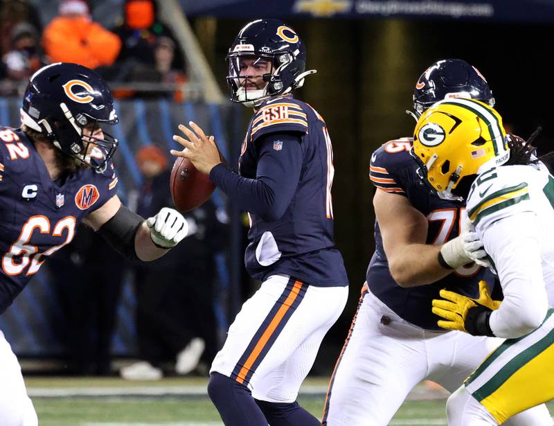 Chicago Bears quarterback Caleb Williams looks for a receiver in the Green Bay Packers secondary Saturday, December 20, 2025, during their game at Soldier Field in Chicago.
