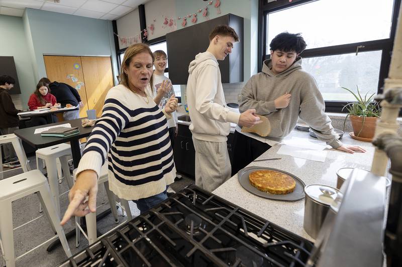 Amy Heffelfinger works with her class as they make frosting for cakes at Rock Falls High School. Teachers Heffelfinger and Heidi Ripley run the Family and Consumer Sciences Department at RFHS.