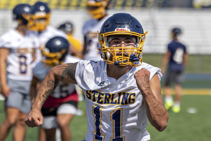 Sterling’s Vitor Polo runs through warm-up drills Monday, August 11, 2025, for the first day of football practice.