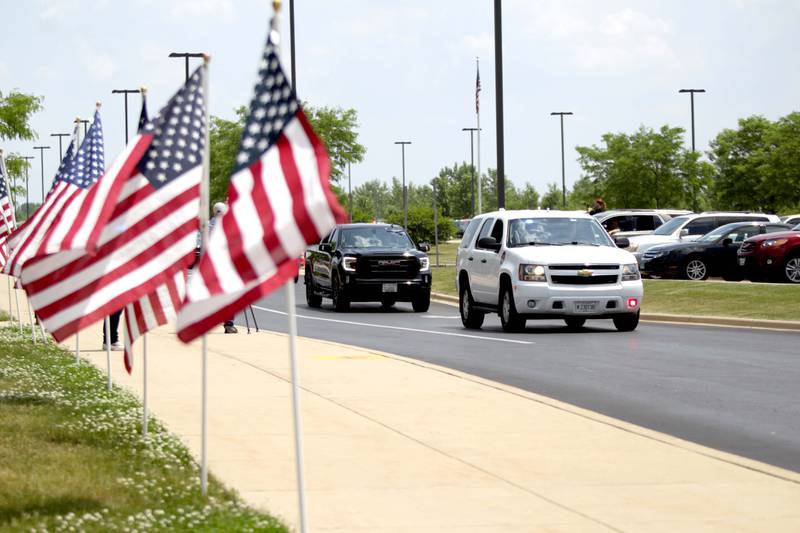 A processional begins during a funeral in honor of Kane County Sheriff K9 Hudson, who lost his life in the line of duty last month, on Thursday, June 1, 2023 at Kaneland Harter Middle School in Sugar Grove.