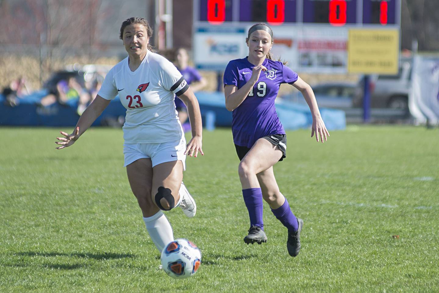 Dixon's Arielle Rockwood and Stillman Valley's Taylor Davis race for the ball Thursday, April 21, 2022.