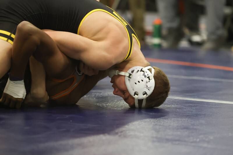 Joliet West’s Carson Weber looks to pin Romeoville’s TJ White in a dual meet on Thursday, Dec.14th, 2023 in Romeoville.