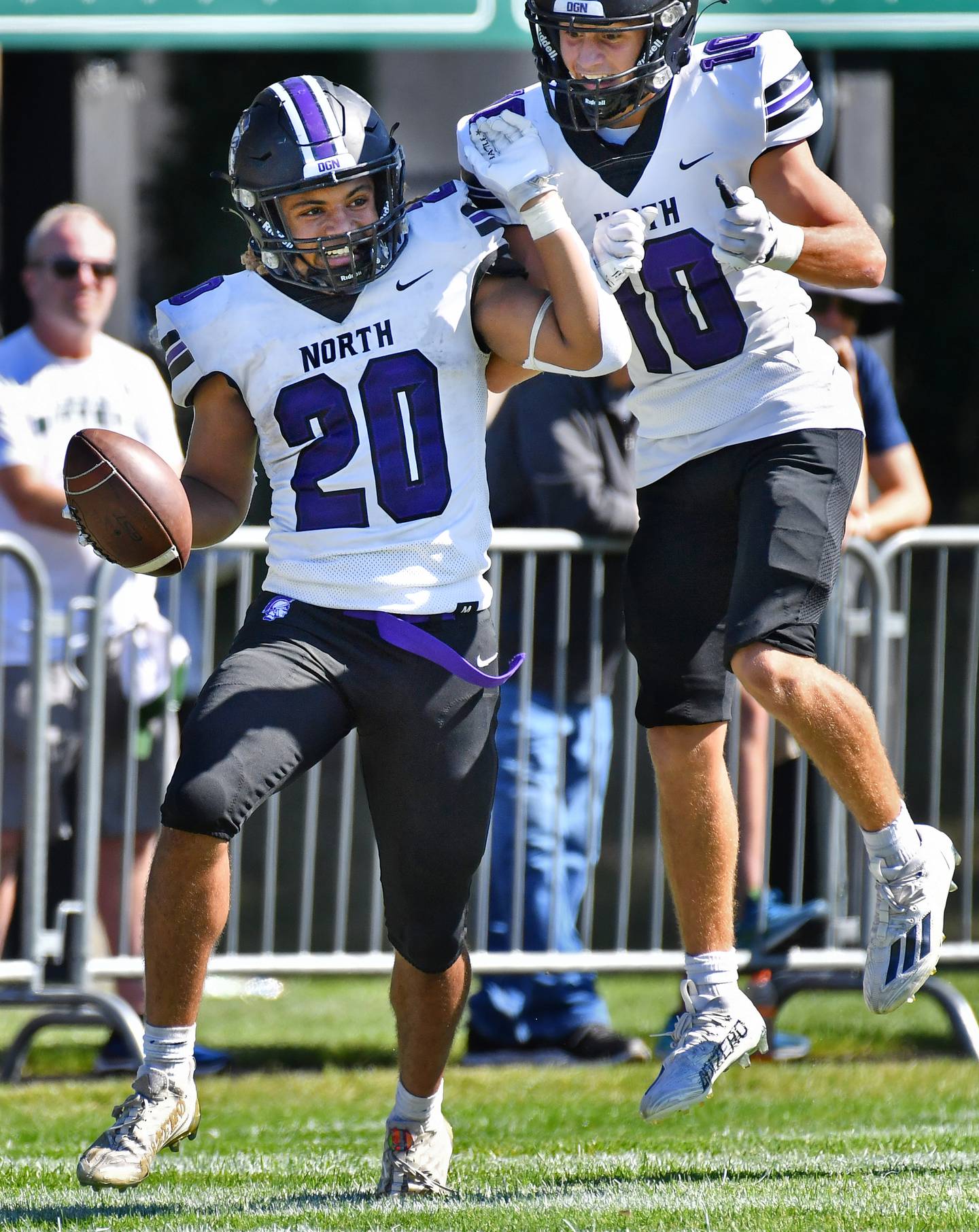 Downers Grove North's Noah Battle (20) celebrates his long touchdown run with teammate Oliver Thulin during a game against Glenbard West on Sep. 9, 2023 at Glenbard West High School in Glen Ellyn.
Jon Cunningham for Shaw Local News Network