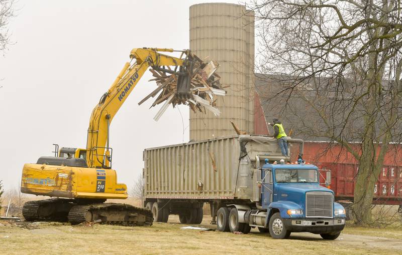 Debra from the Peck farm house at 64 Peck Road in Geneva is loaded into a truck during the demolition on Wednesday, March 22, 2023.