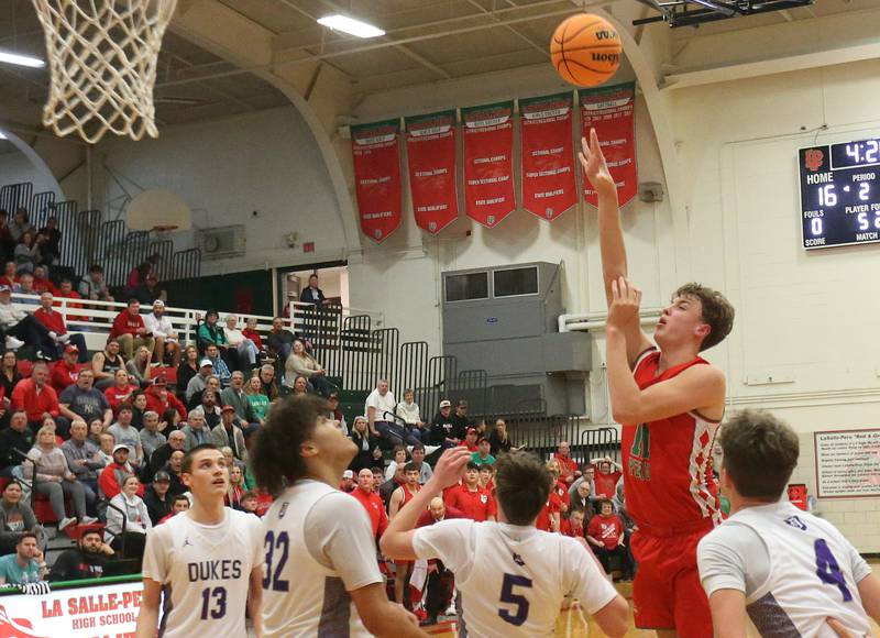 L-P's Jameson Hill lets go of a jump shot in the lane over Dixon's Brady Felt during the Class 3A Regional semifinal game on Wednesday, Feb. 26, 2025 in Sellett Gymnasium at L-P High School.