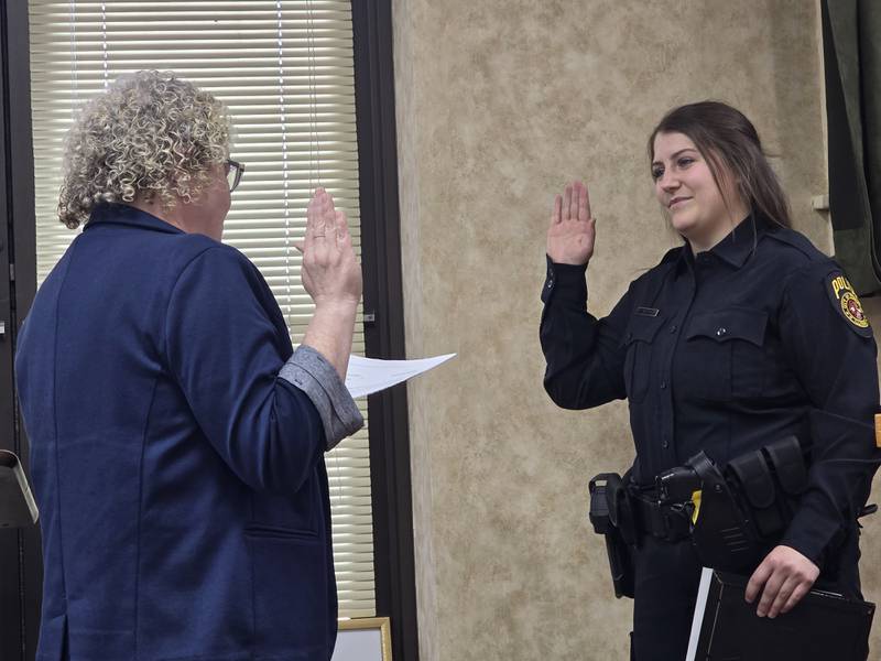 Princeton Police Officer Taylor Wetsel recites her oath Monday, May 5, 2025, with City Clerk Janet Henning at Princeton City Hall.