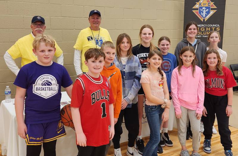 Pictured are the winners of the Knights of Columbus' free throw championship along with several Knights of Columbus members.