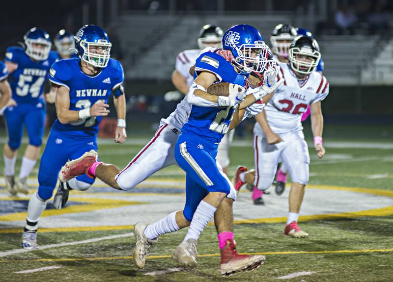 Newman's Nolan Britt is brought down after picking up big yards Friday, Oct. 8, 2021 against Hall.