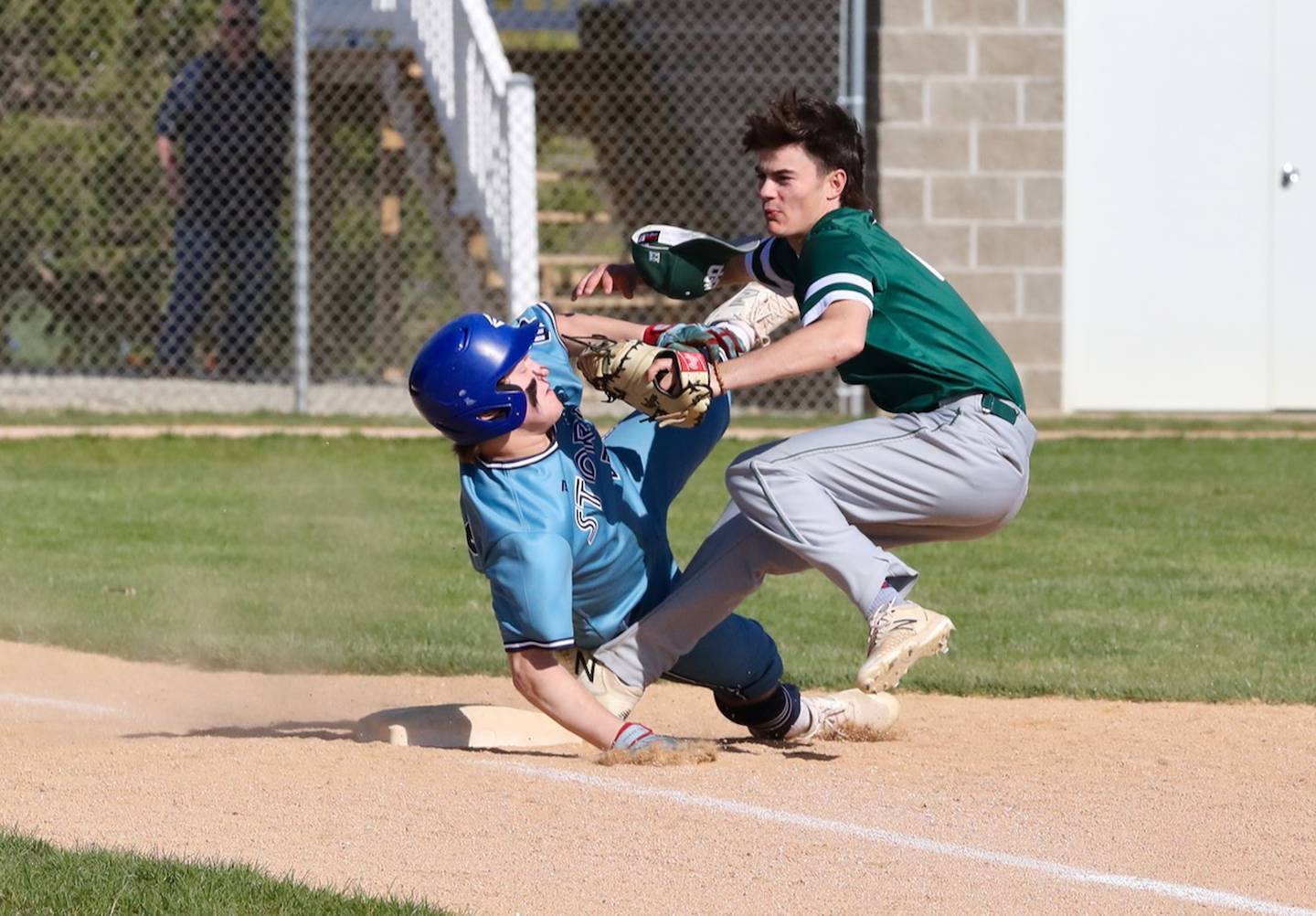 Bureau Valley's Ayize Martin (left) collides with St. Bede's John Brady on Thursday, May 4, 2023 in Manlius.