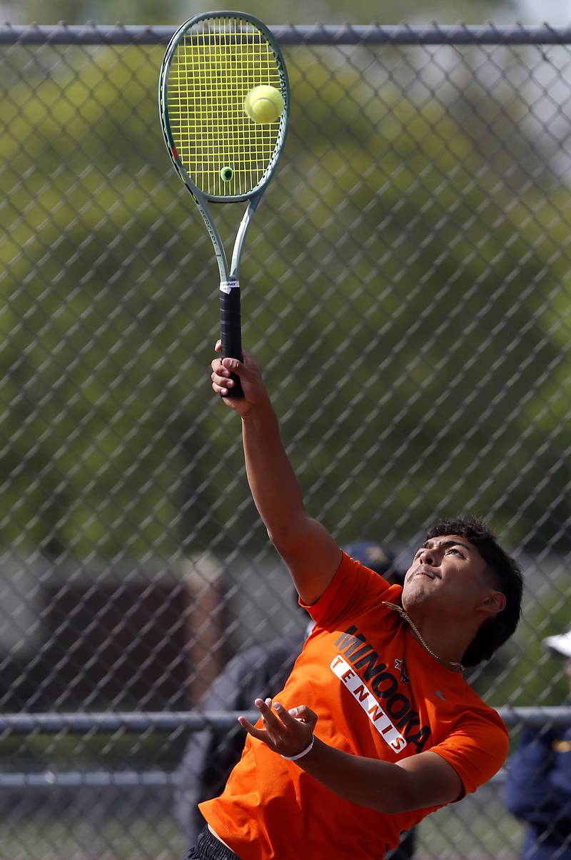 Minooka’s Eli Chavez serves the ball as he and his doubles partner, Evan Lundeen, compete in the Class 2A Boys State Tennis Tournament on Thursday, May 29, 2025, at Palatine High School.
