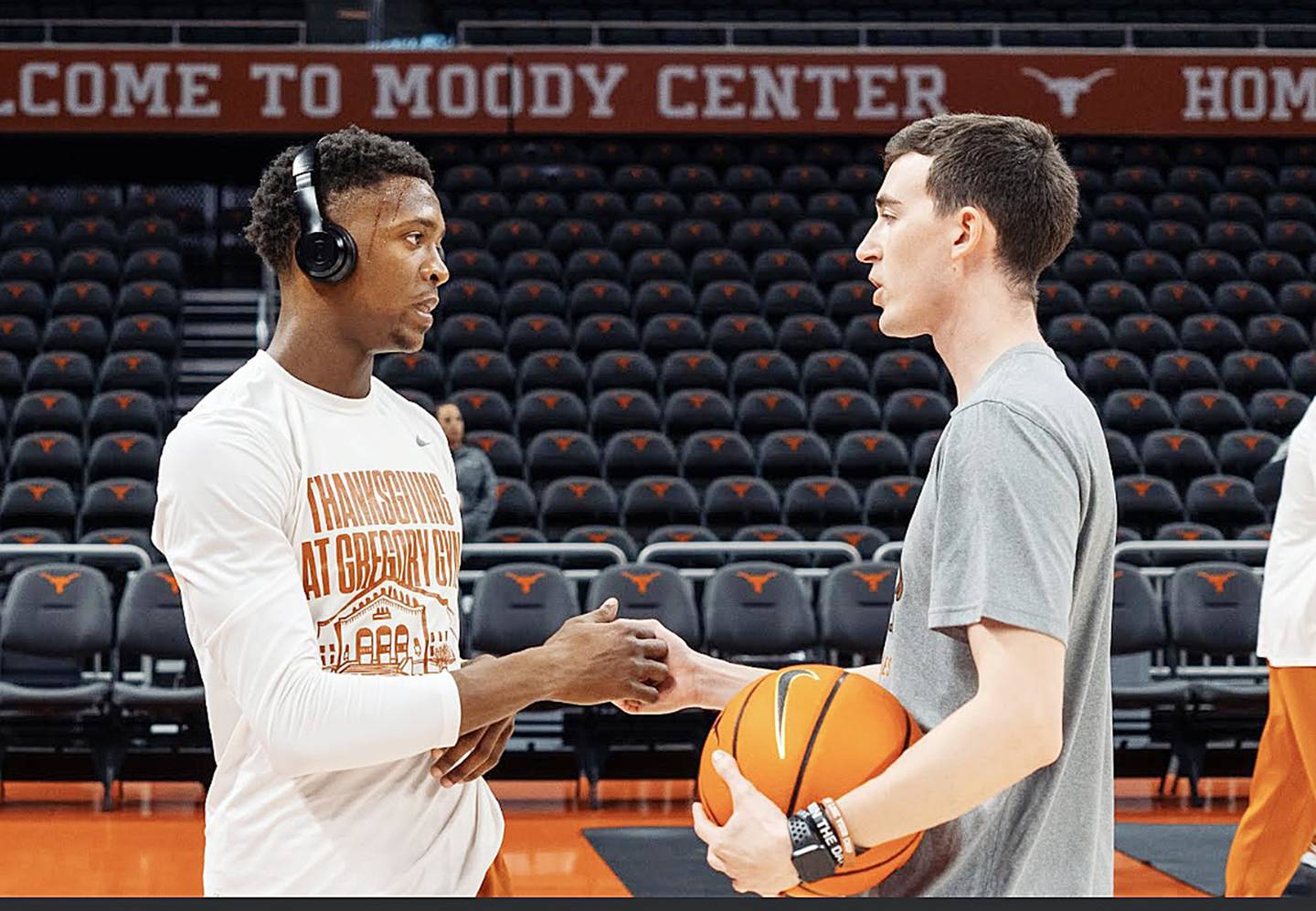 Rock Falls native KJ Conklin talks to Texas Longhorns player Sir'Jabari Rice before practice last season at the Moody Center in Austin, Texas.