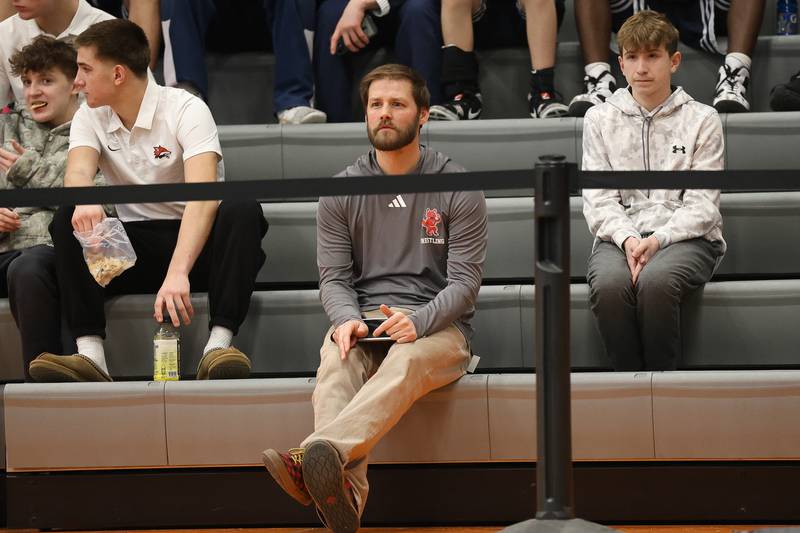 Yorkville head coach Jake Oster watches the SouthWest Prairie Conference 175 pound championship from the stands on Saturday, Jan. 24, 2026 in Minooka.