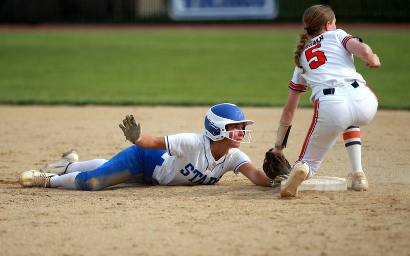 St. Charles North’s Addy Umlauf is safe at second under the glove of Whitney Young’s Kate Coonan during the Class 4A St. Charles North Supersectional on Monday, June 3, 2024.