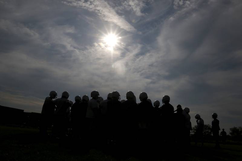 Hampshire football players huddle up during the first day of football practice Monday, August 7, 2023, at Hampshire High School.