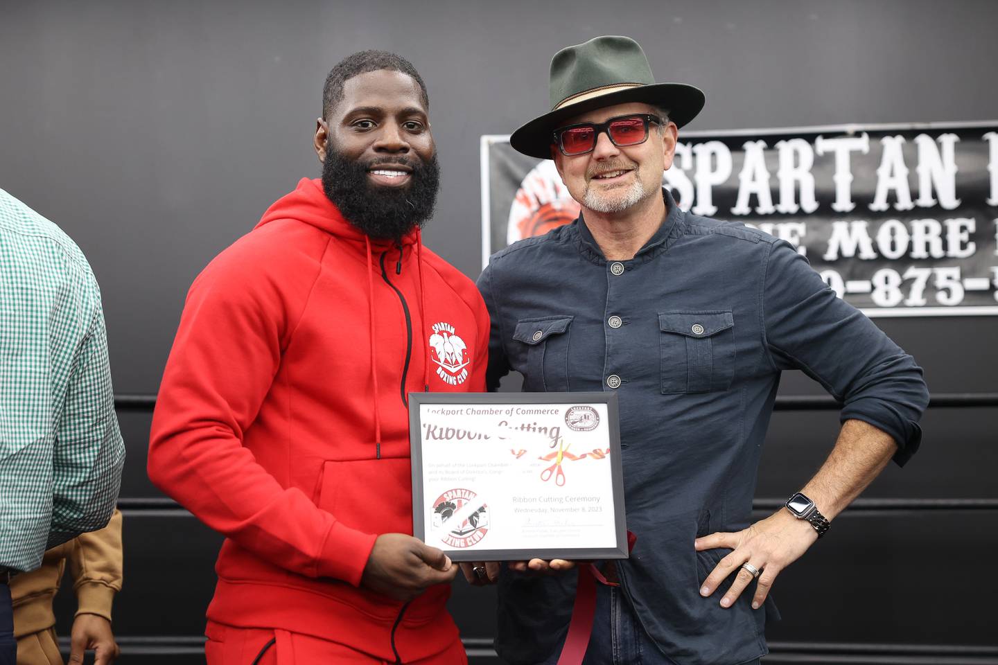 Co-owner Kenny Bragg, left, poses for a photo with Lockport Mayor Steven Streit at the ribbon cutting ceremony for Spartan Boxing on Wednesday, Nov. 8, 2023 in Lockport.