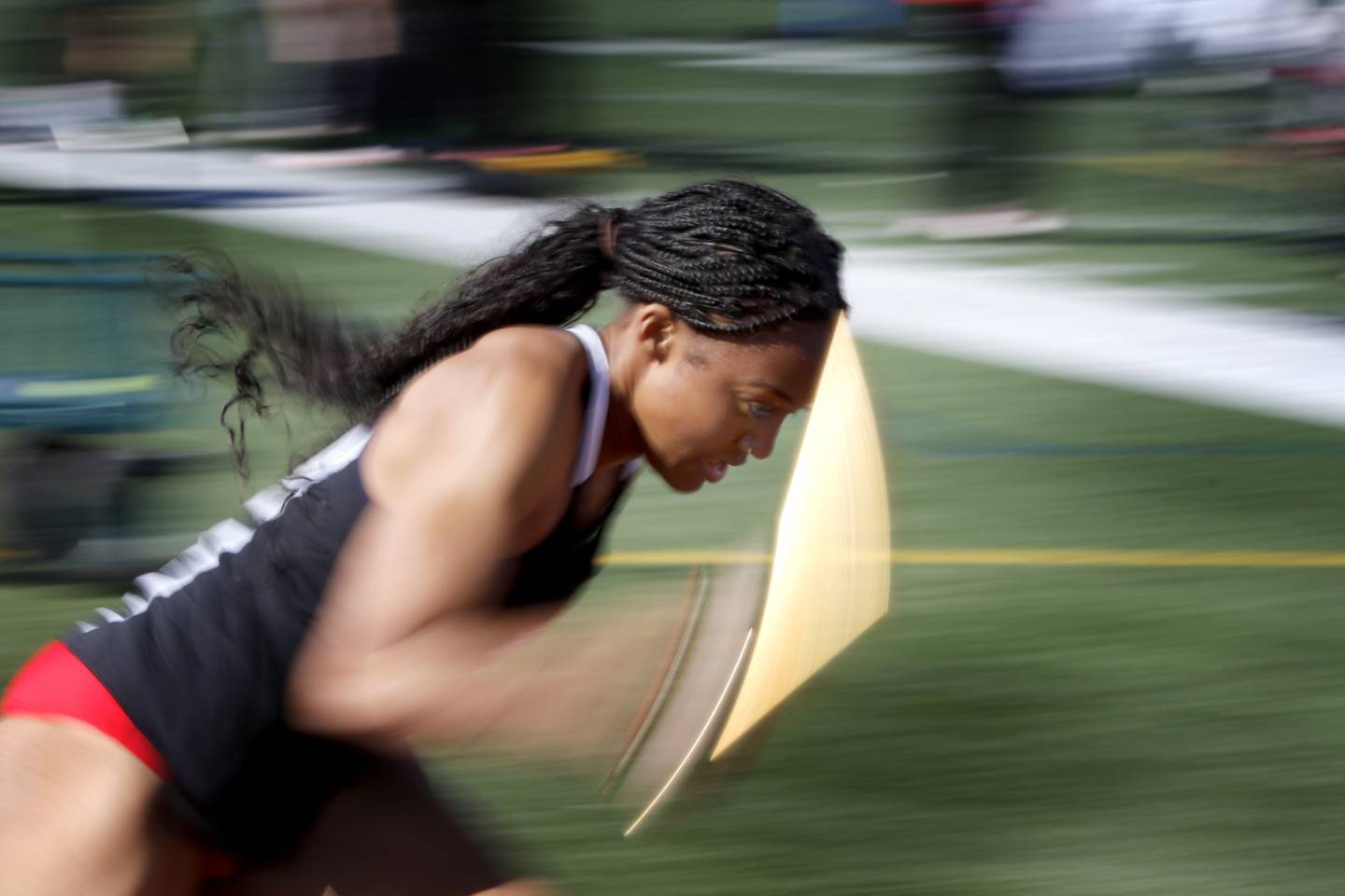 Huntley’s Dominique Johnson run the first leg of the 4x100 meter relay for her team on Thursday, May 8, 2025, during the Fox Valley Conference Girls Track and Field Meet at Huntley High School.