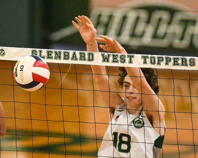 Glenbard West's Charlie Clifford (18) blocks the ball during the game against Oak Park-River Forest on Tuesday April 16, 2024, held at Glenbard West High School.