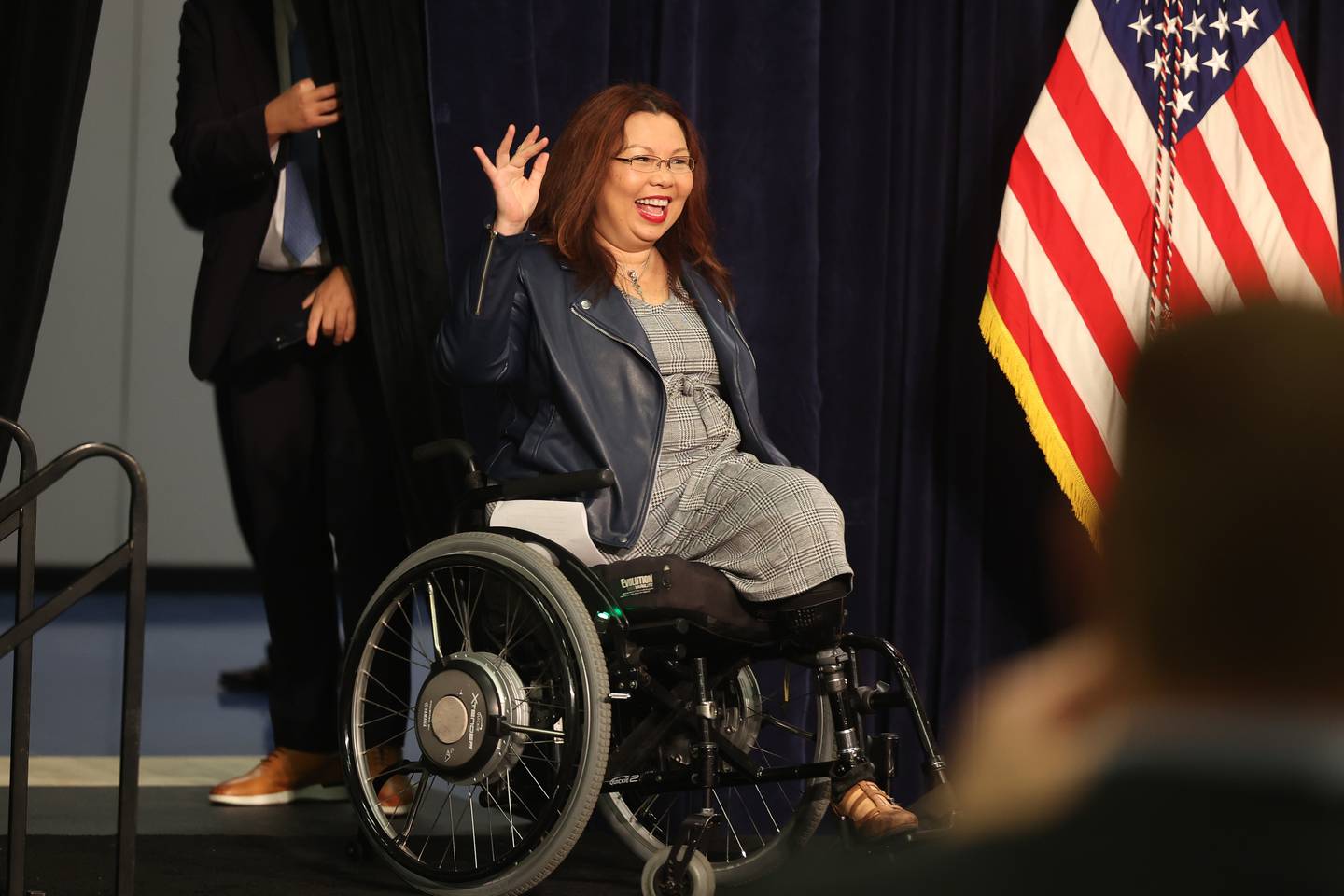 Senator Tammy Duckworth takes the stage before President Joe Biden scheduled speech during his stop in Joliet at Jones Elementary School on Saturday.