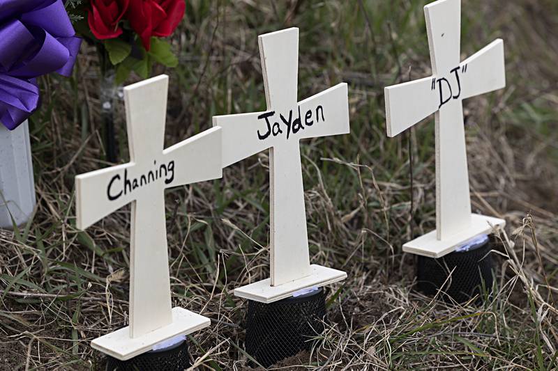 A roadside memorial is seen Friday, March 29, 2024, at the site where three Prophetstown-Lyndon-Tampico High School/Middle School students were killed in a crash at the corner of Luther and Hahnaman Roads.