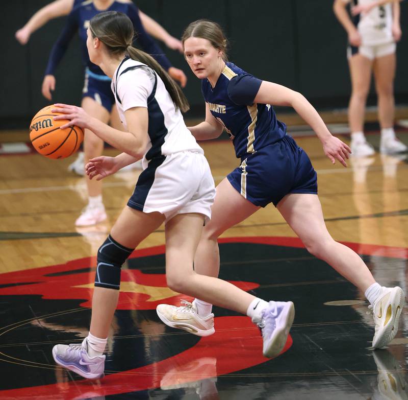 Marquette's Emily Ryan-Adair plays defense against Rockford Christian's Josie Becker Tuesday, Feb 24, 2026, during their Class 1A sectional semifinal game at Indian Creek High School in Shabbona.