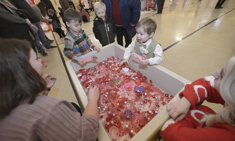Preschool students at Lincoln Elementary play a Valentine-themed game of skill during a Valentine's Family Fun Day event Friday, Feb. 14, 2025, at Lincoln Elementary School in Ottawa.