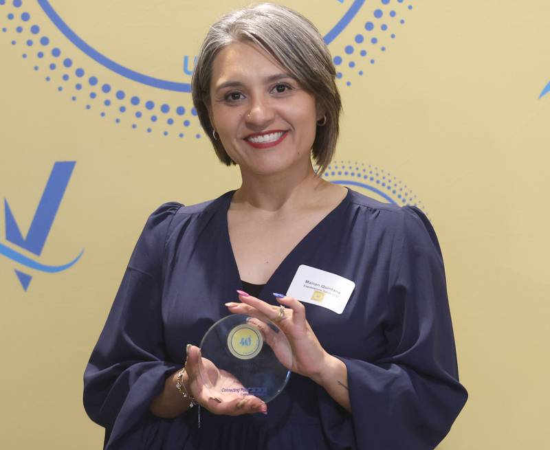 Marion Quintana poses with her 40 Under Forty award during the Illinois Valley Chamber of Commerce Champions of Change Awards Night on Wednesday, May 6, 2026 at the Westclox Event Center in Peru.
