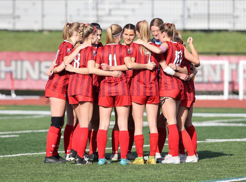 Hinsdale Central huddles up before the match against Lyons Township in Hinsdale on Tuesday, April 18, 2023.