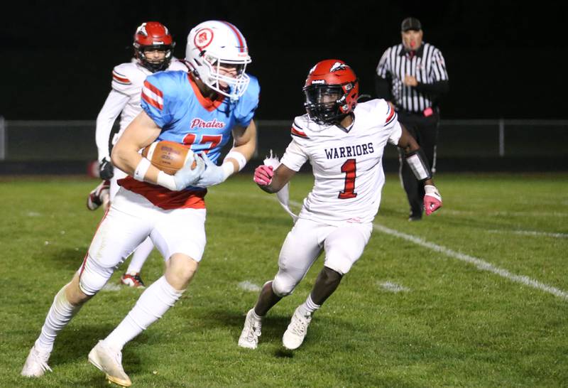 Ottawa's Owen Sanders eyes the end zone as Granite City's Kaysen Emerson arrives late to the play on Friday, Oct. 24, 2025 on Kingman Field at Ottawa High School.