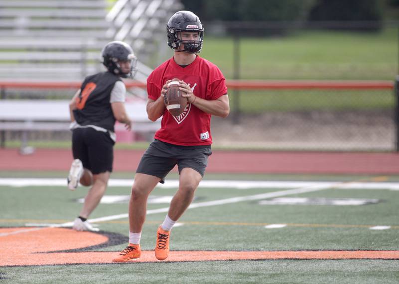 St. Charles East’s Mac Paul looks to throw the ball during the first day of practice for the fall season on Monday, Aug. 7, 2023 at the school.