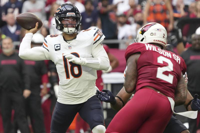 Chicago Bears quarterback Caleb Williams (18) throws under pressure from Arizona Cardinals linebacker Mack Wilson Sr. (2) during the first half of an NFL football game, Sunday, Nov. 3, 2024, in Glendale, Ariz. (AP Photo/Rick Scuteri)