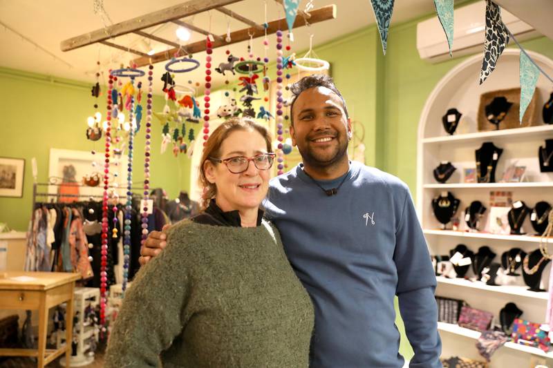 Madhav Pandey (right), who lives with is family in Kathmandu, Nepal, has a fair trade business of over 400 full and part time employees and they make artistic felt items by hand. Geneva resident Marla Showfer (left) and her company, The Winding Road, imports his items for 1,000 retail stores throughout the country. The Little Traveler in Geneva is the only local store that carries the works of art in their fair trade room.