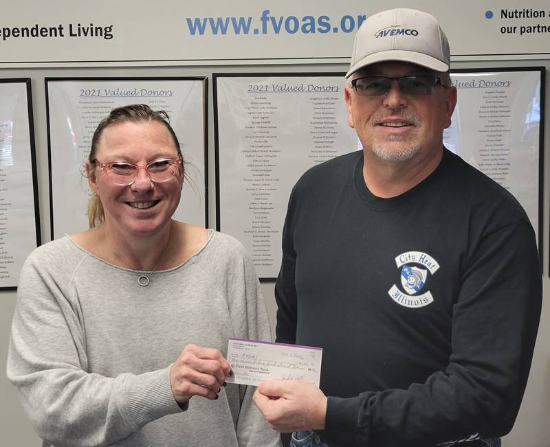 (Left to right); FVCS Executive Director Suzanne Kinsey receiving a donation check from Jack Holley of City Heat Motor Cycle Association.