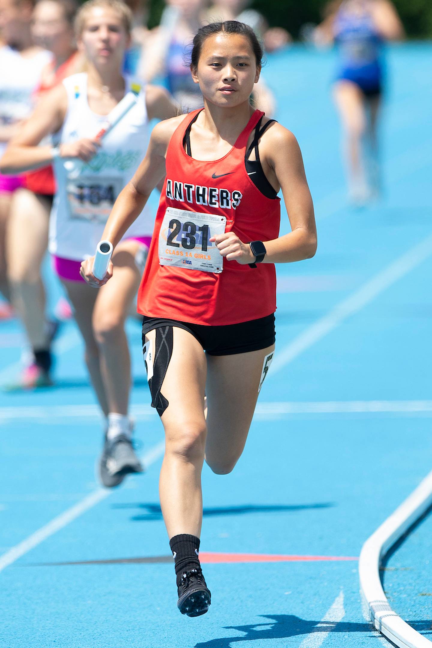 June 10, 2021- Charleston, IL -Erie-Prophetstown's Jade Nickerson competes in the Class 1A 4x800-Meter Relay during IHSA Girls State Track and Field Finals. [Photo: Douglas Cottle/PhotoNews]