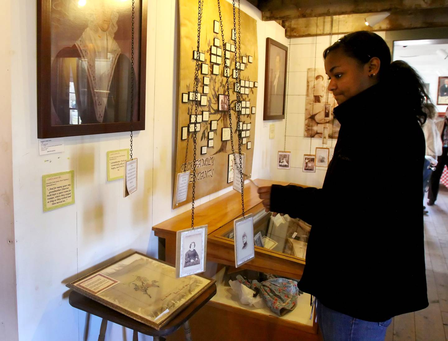Visitors look at displays at the Sheldon Peck Homestead in Lombard.