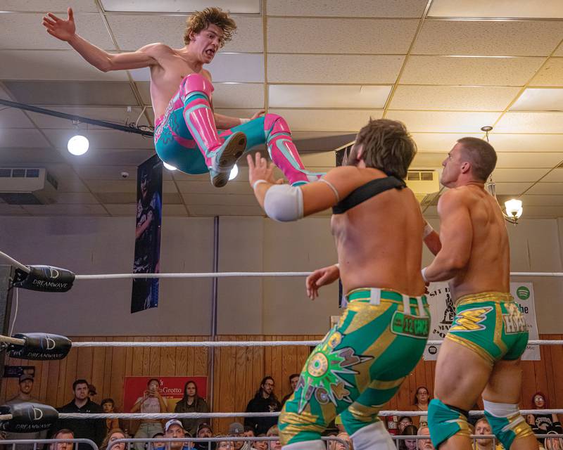 A member of the professional wrestling tag team The New Guys (left) hurtles toward both members of The Hype during Dreamwave Wrestling's "Famous Last Words" event Feb. 8, 2025, at the Knights of Columbus hall in La Salle.