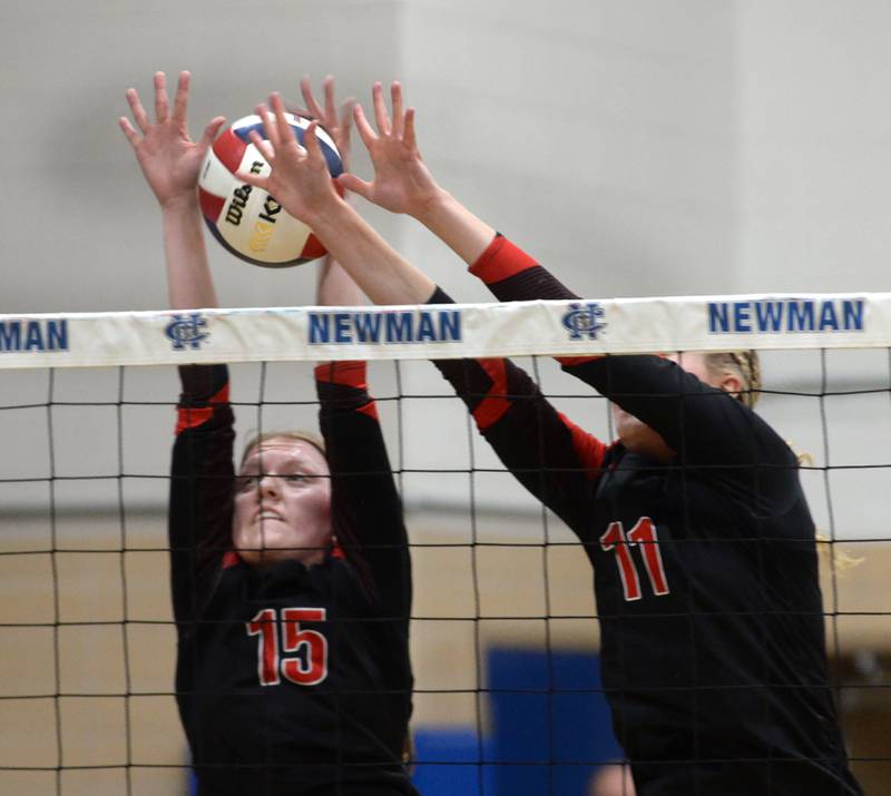 Erie-Prophetstown's Lauren Abbott (11) and Kaylee Keegan (15) block against Rock Falls during the championship of the 2A Sterling Newman Regional on Thursday, Oct. 31, 2024.